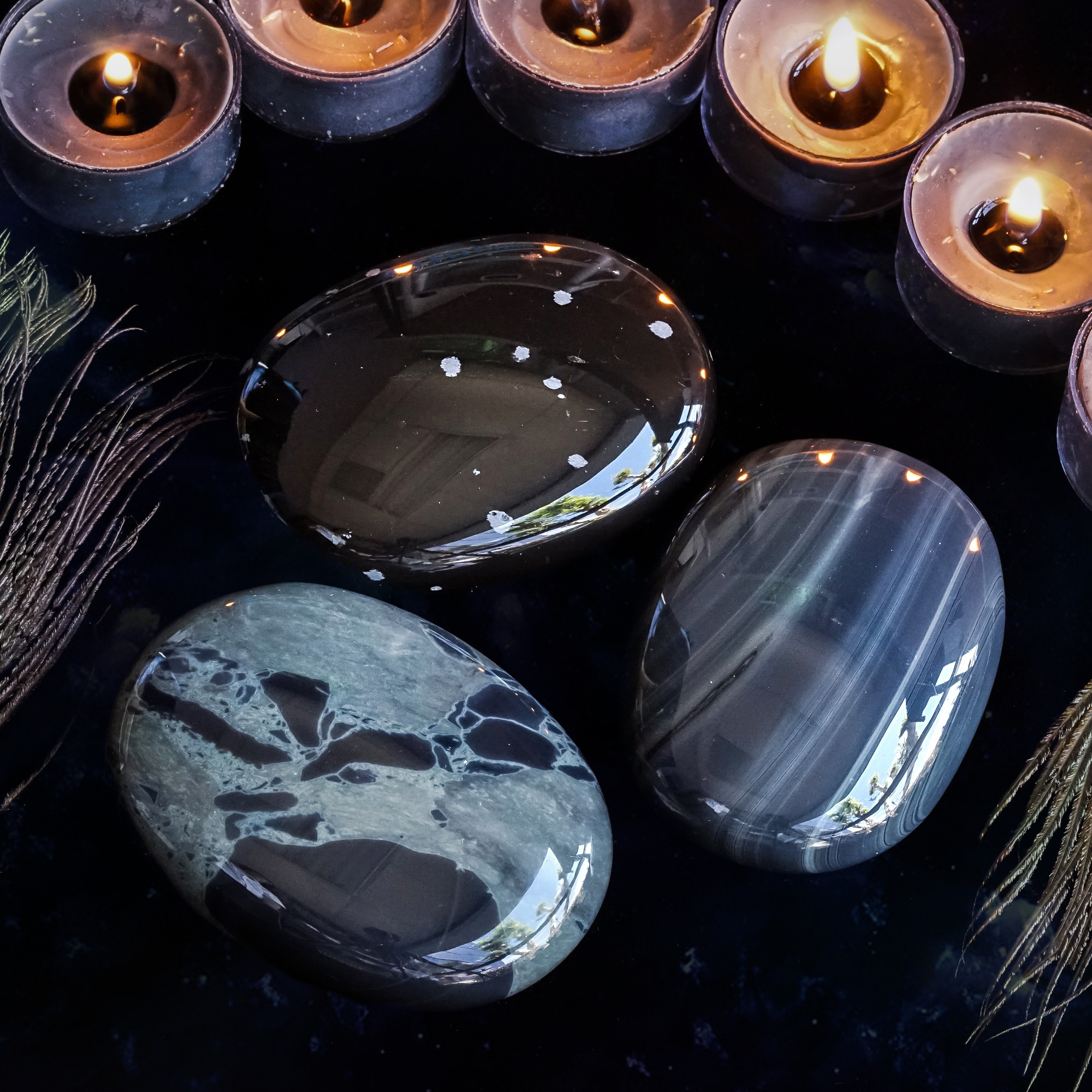 intuitively chosen obsidian palm stones